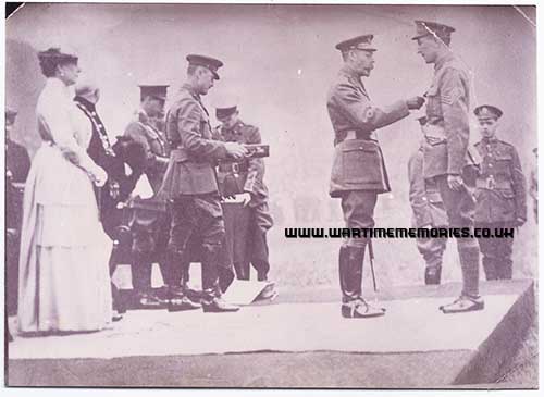 receiving his medal from George V